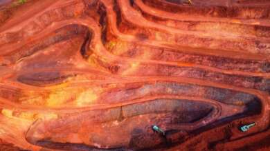 Analysis of how a stalled Nasdaq is driving capital rotation into ASX mining stocks as iron ore and commodity earnings strengthen.